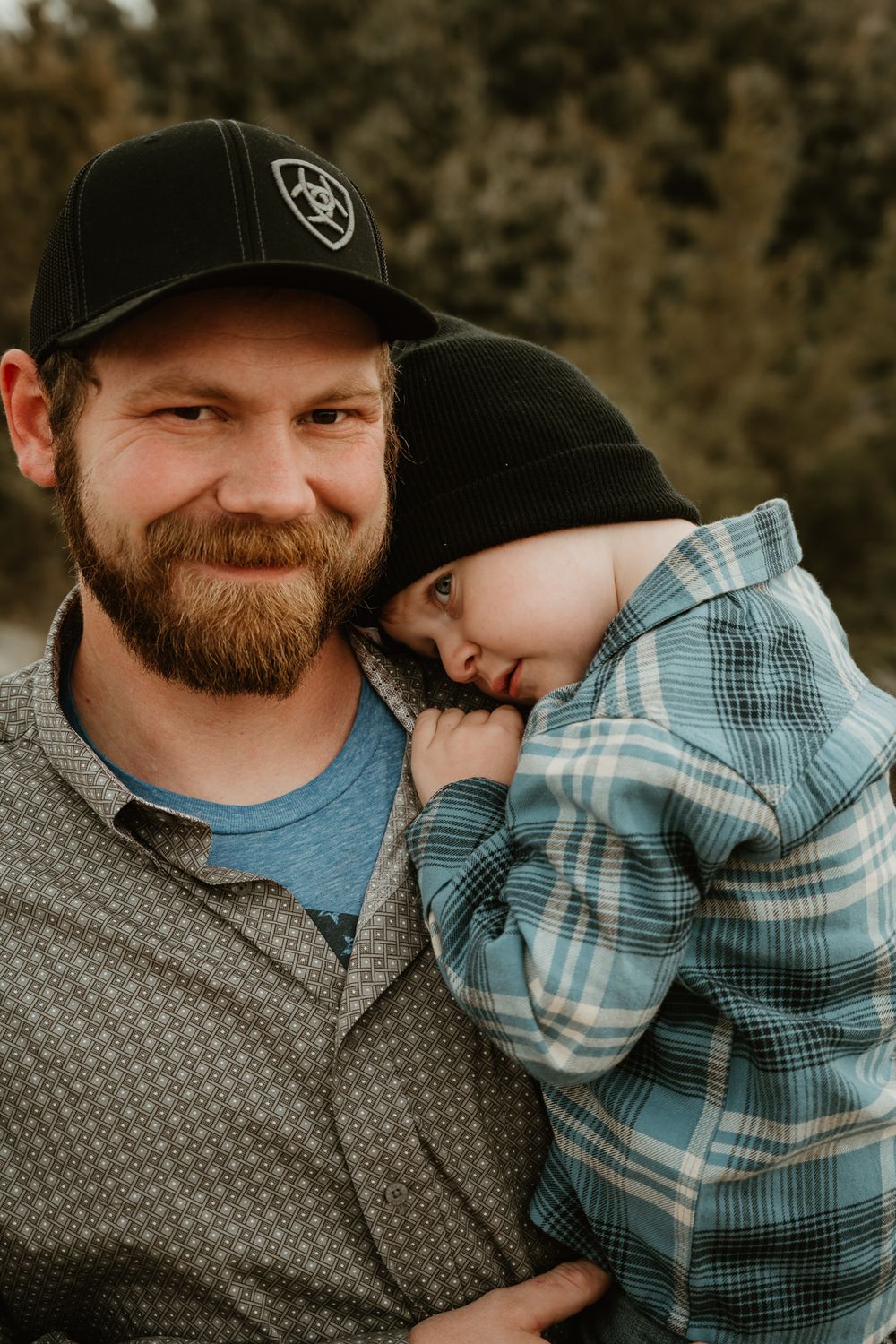 Intimate close-up portraits showing tender moments between parent and child outdoors.