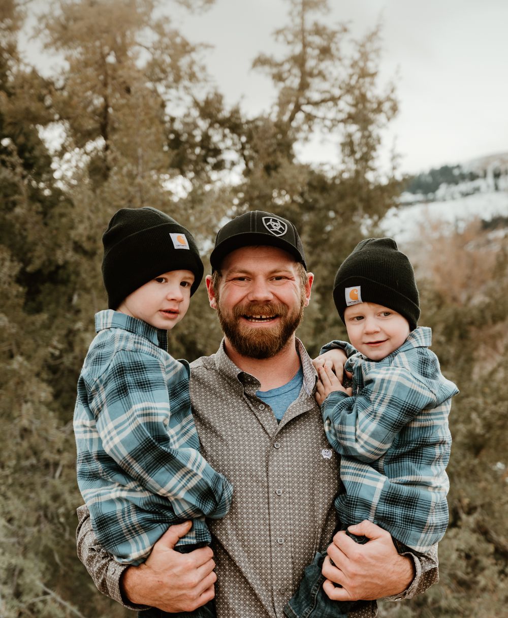 A joyful winter family photo session with matching outfits and genuine smiles.
