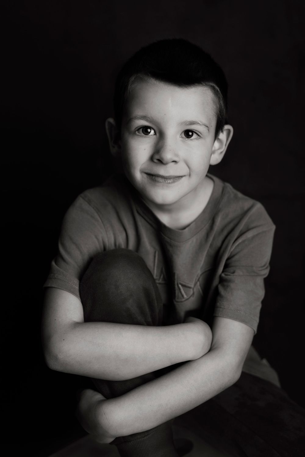 Child Photography Melbourne, black and white photo of boy holding his knees