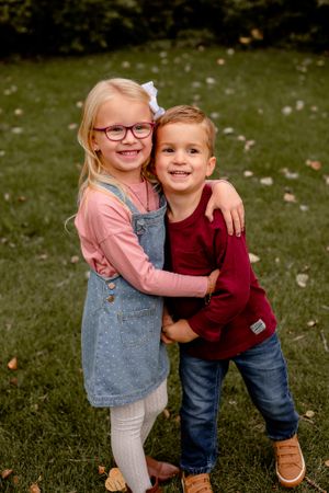 brother and sister hugging