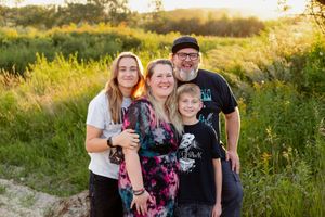 family with teenage boys striking a pose