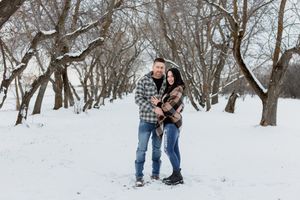 couple gets cozy in winter setting