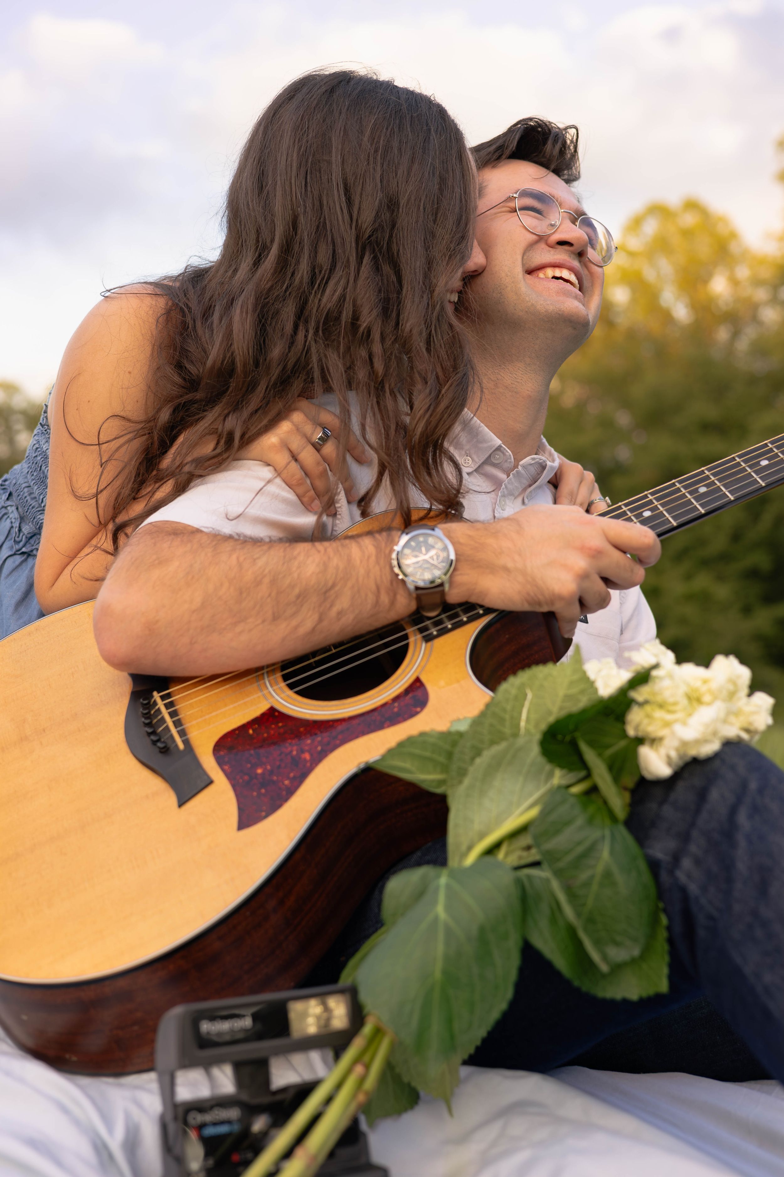 Golden Hour Couples Session at Walnut Creek Park on a blanket with a guitar.