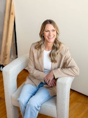 Lifestyle photo series showing relaxed poses in armchair wearing business casual attire.