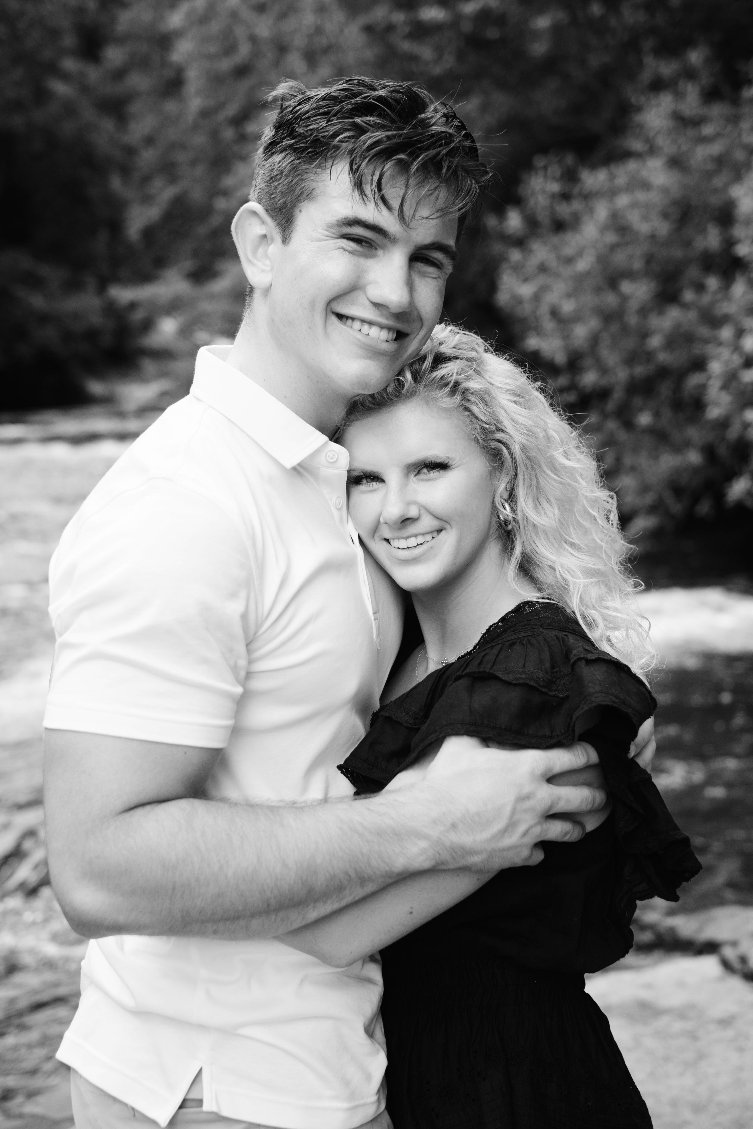 Adventure proposal portraits on rocks above Rainbow Falls