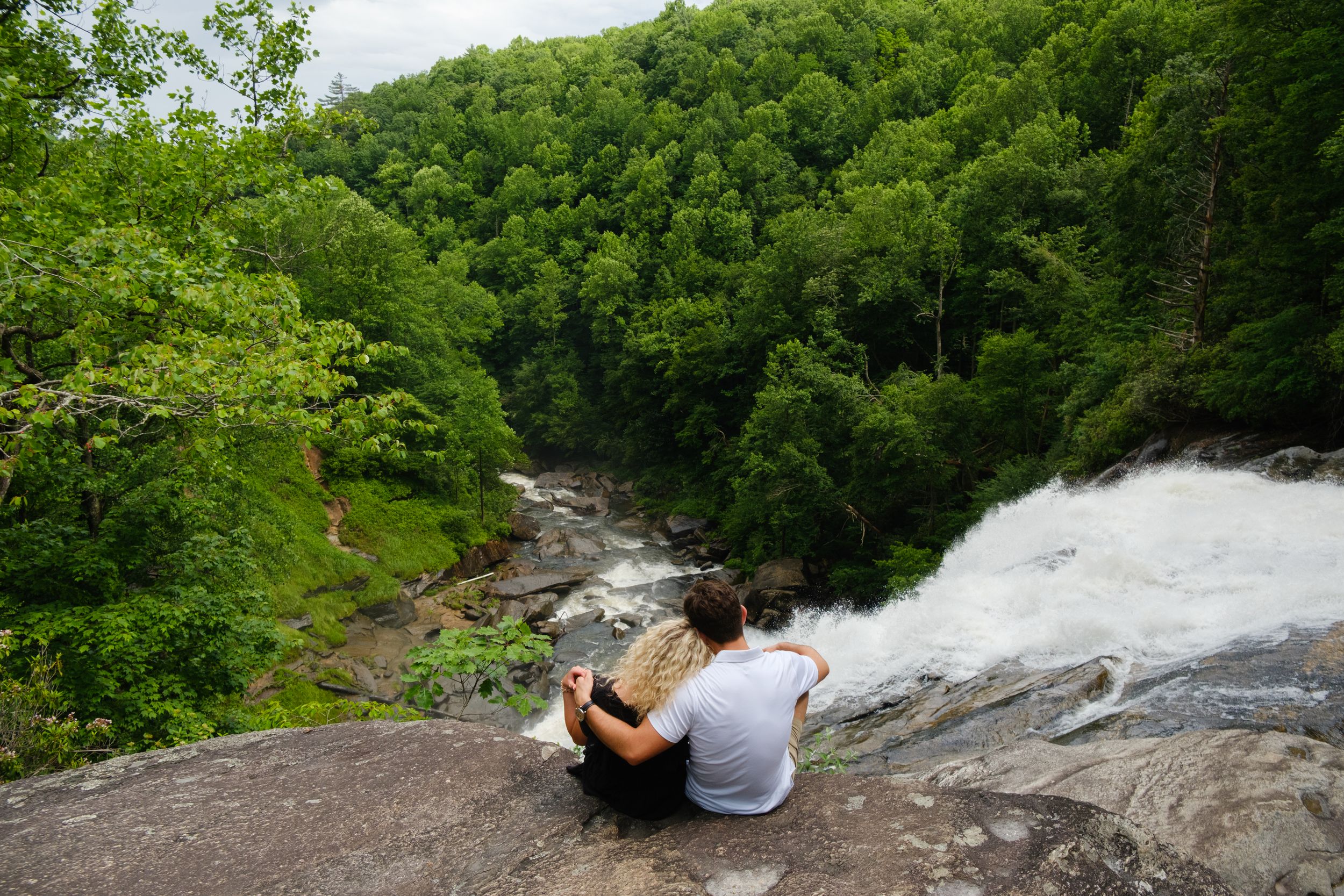 Braydon and Greenlee exploring waterfall overlooks after their proposal