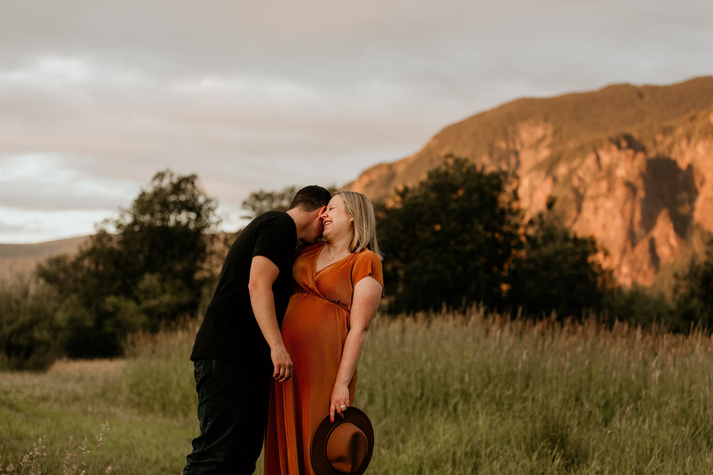 Golden hour family session in North Bend Washington with Washington portrait & wedding photographer walking through a grassy meadow