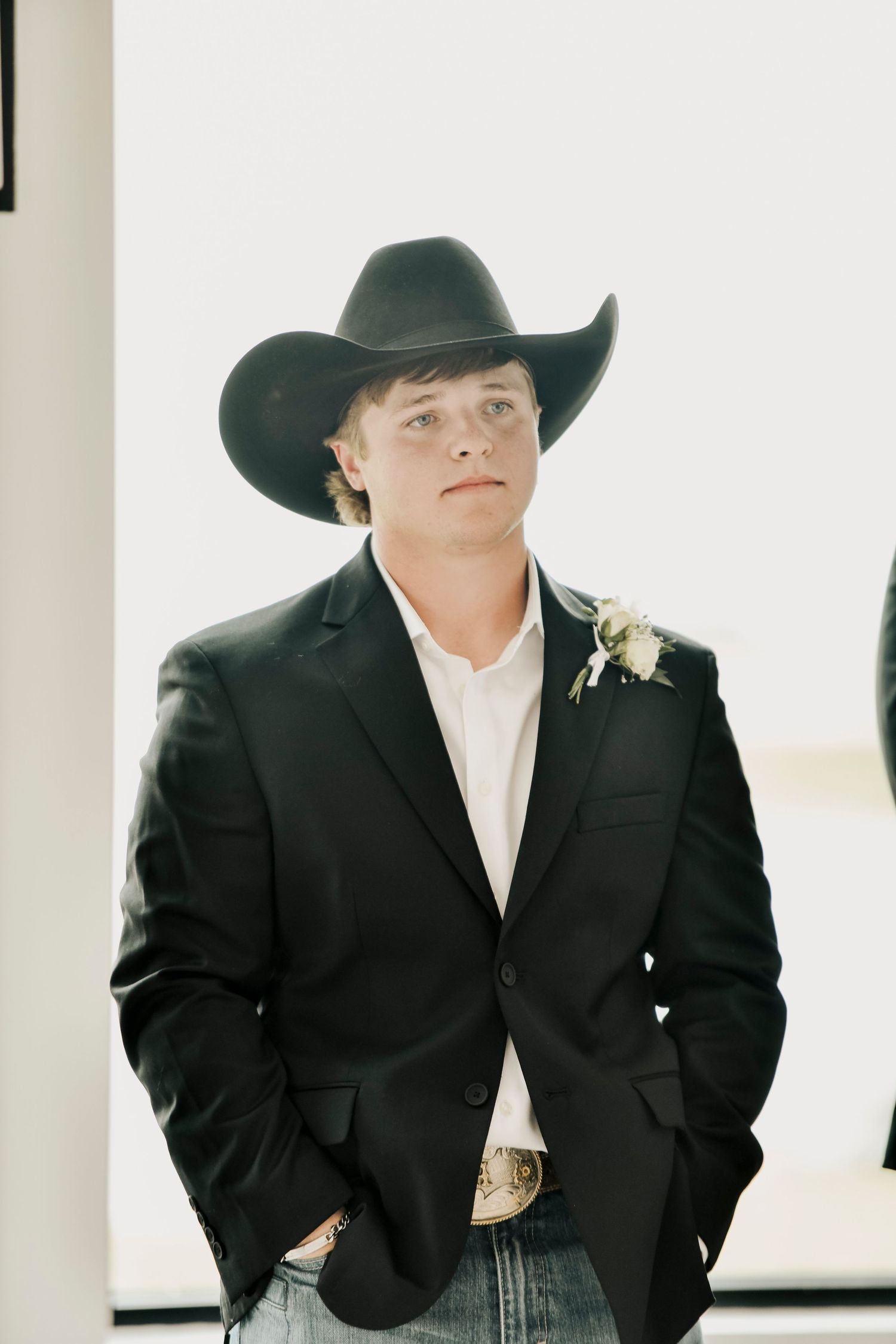 The groom looking at the bride walking down the aisle