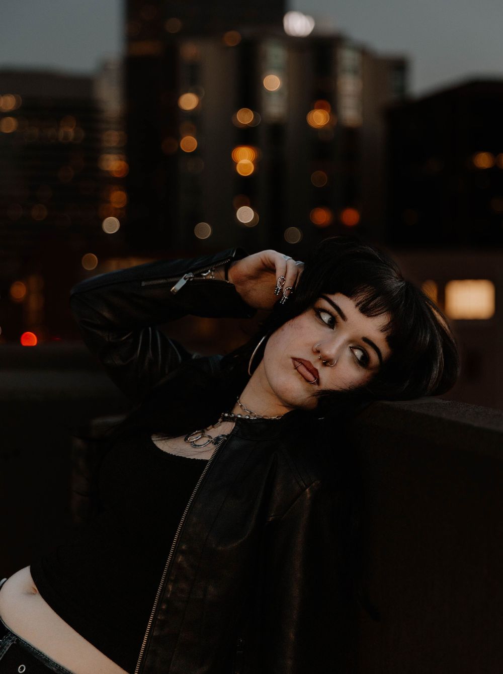 Girl lays on wall for moody, cinematic, urban, portrait, senior photos in Denver, Colorado outside, urban, and nature photos