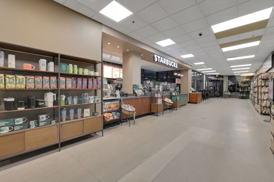 Interior view of a Starbucks coffee shop inside a Busch's grocery store with merchandise shelves.