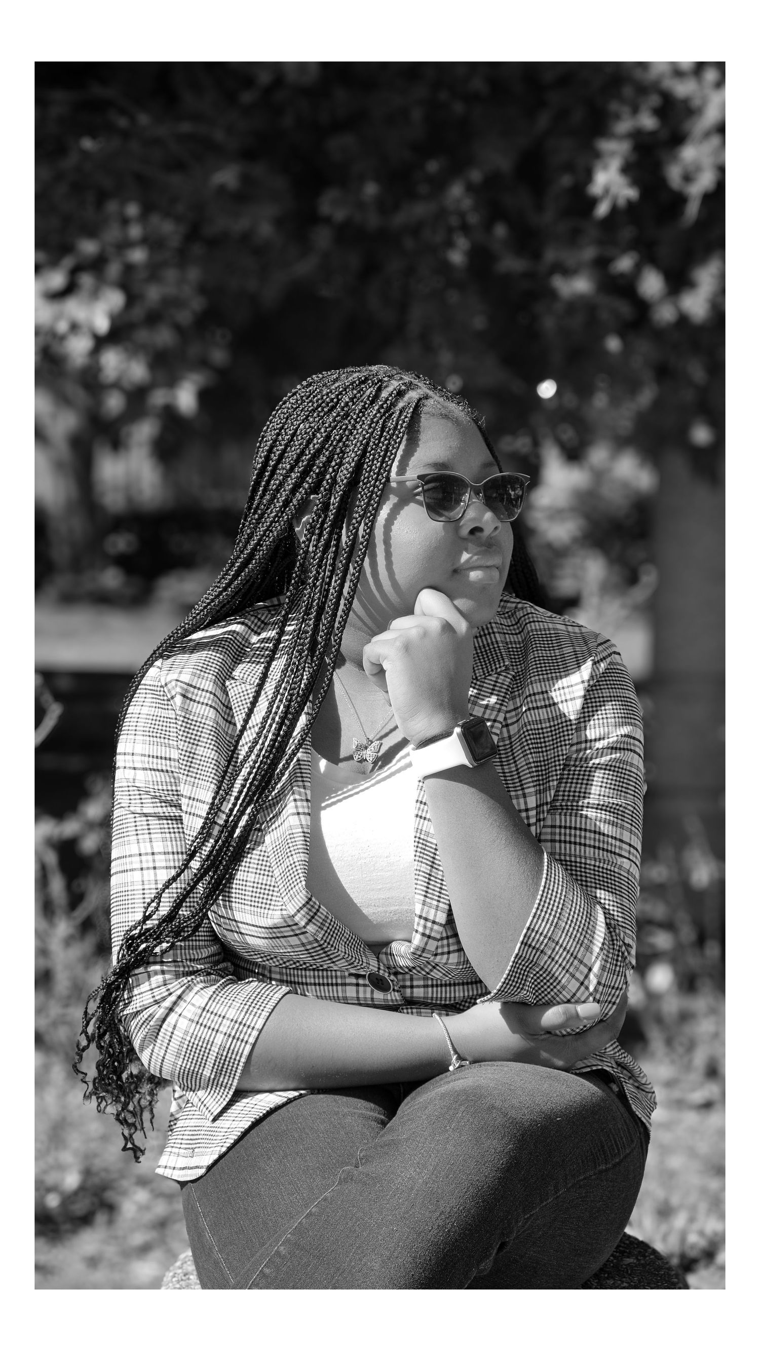 A black and white outdoor portrait series showing someone wearing a plaid blazer Ellucid Design Studio LLC Saginaw Michigan