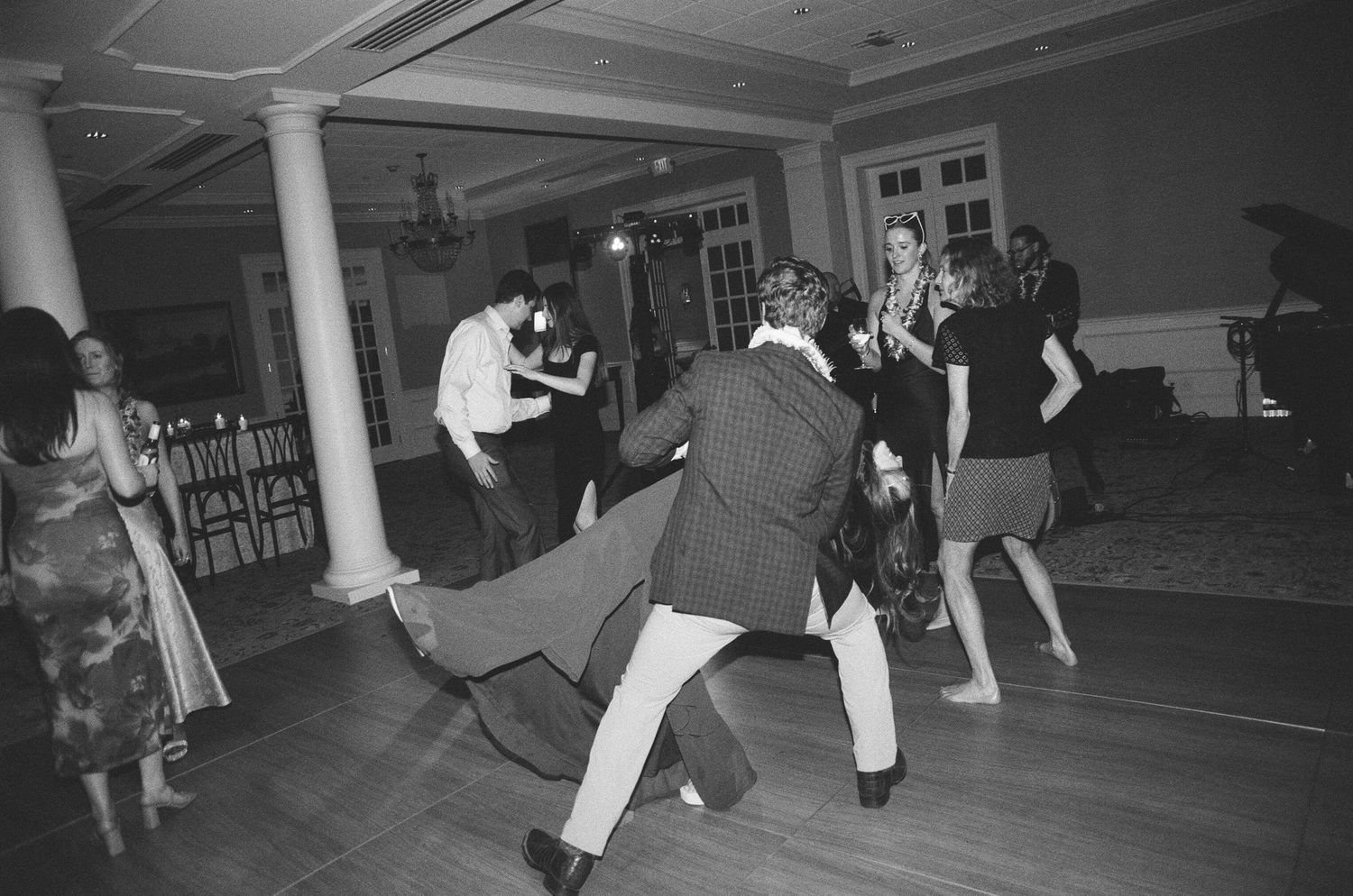 Black and white photos show dancers practicing swing dance moves in a dance studio during a group class.