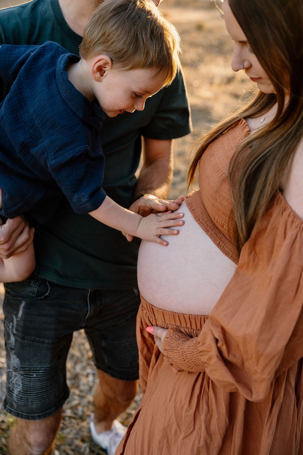 A touching maternity photography sequence showing intimate moments between parent and child in warm sunset lighting.