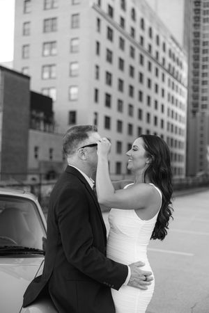 A romantic series of black and white wedding photos showing a couple embracing against an urban backdrop.