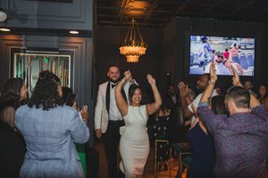 Bride and wedding guests celebrating on the dance floor at a Long Island wedding reception