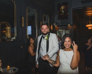 Bride and groom celebrating with guests at their Massapequa wedding reception