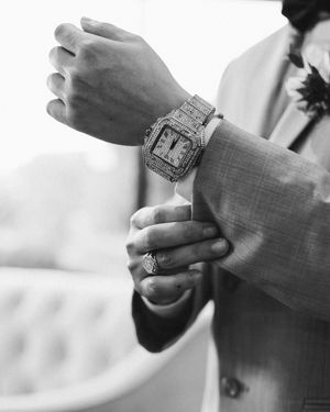 Close-up of hands exchanging rings during a wedding ceremony.