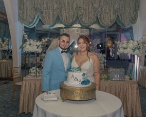 Wedding reception venue decorated with elegant table settings and centerpieces.