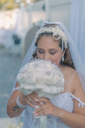 Close-up of bride's veil and lace details during wedding photoshoot.