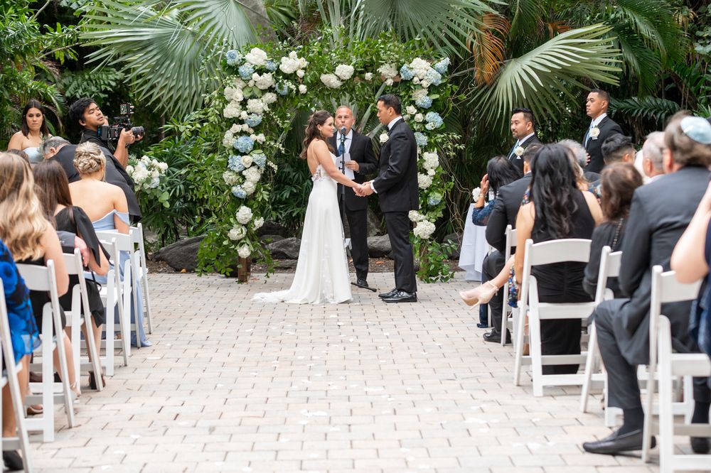 Joyful reception with traditional Samoan dance, highlighted by luxury wedding photographers in Florida.