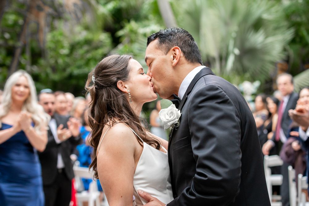 Samantha and JR celebrating with guests near the yachts at Bahia Mar – perfect for Treasure Coast wedding photographers’ portfolios.