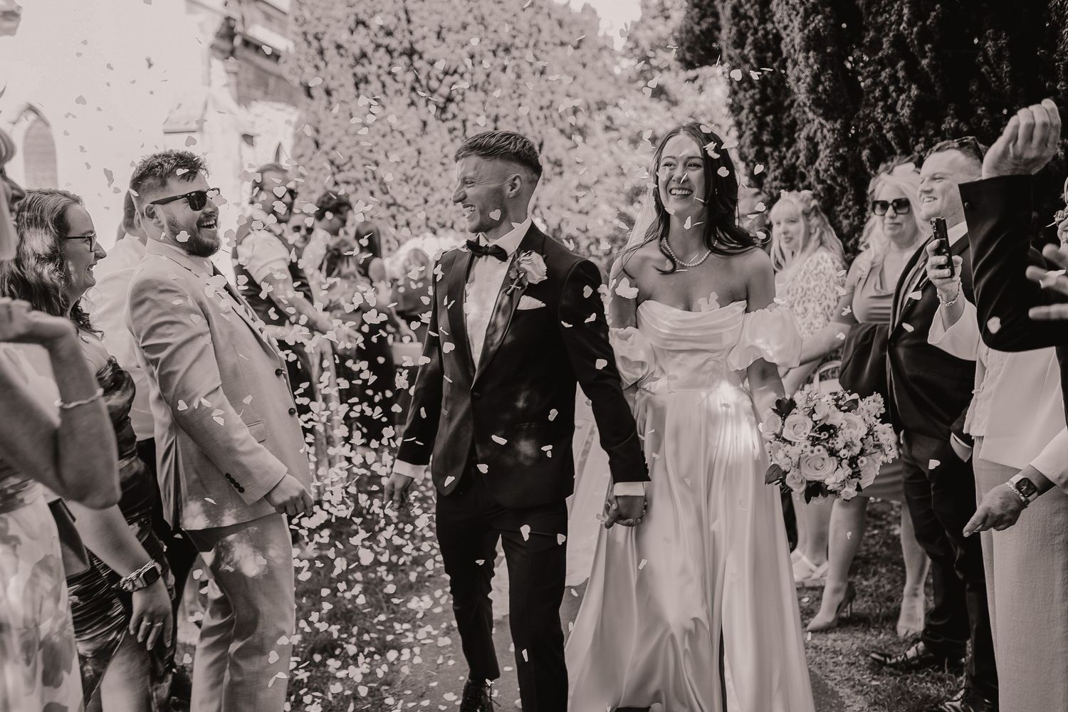 Wedding guests tossing confetti during joyful celebration outdoors. Photographer. Hull. East Yorkshire. Photography