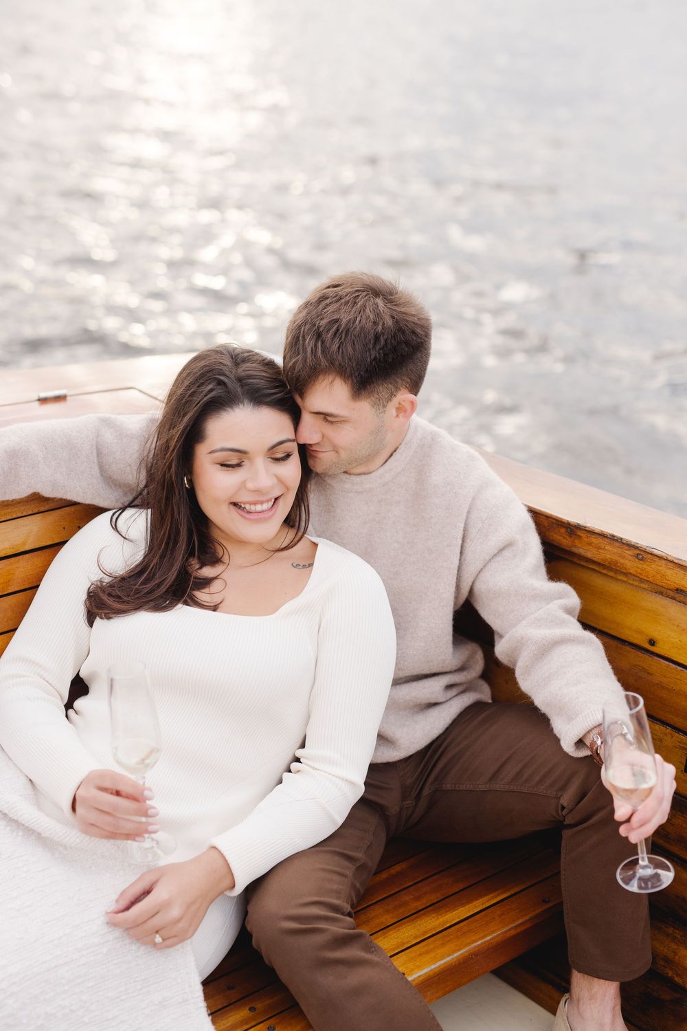 Romantic engagement photo on a Delaware River boat ride in Philadelphia, capturing love, elegance, and waterfront charm.