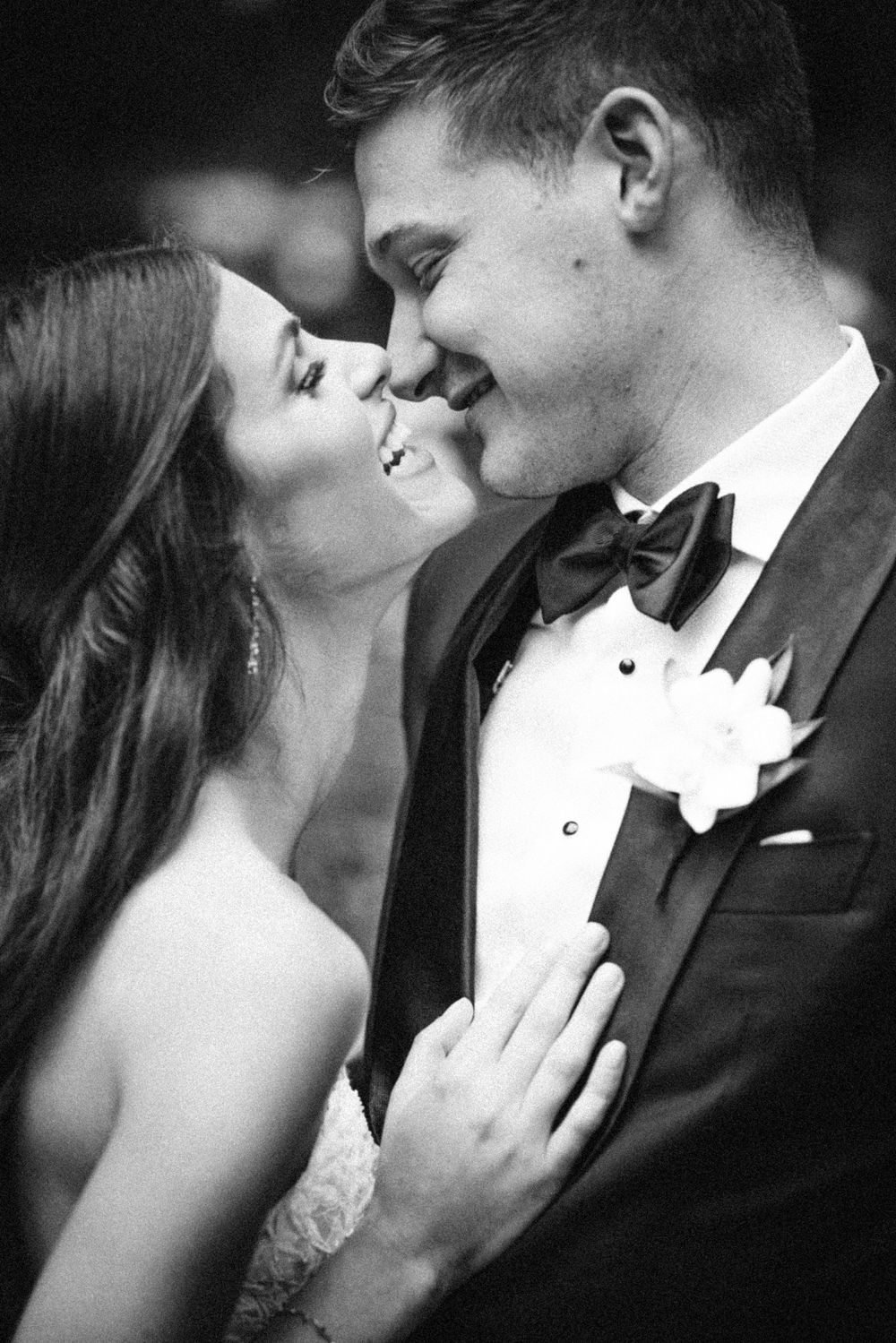 Romantic black-and-white wedding photo of bride and groom sharing a joyful moment at The Westin Philadelphia.