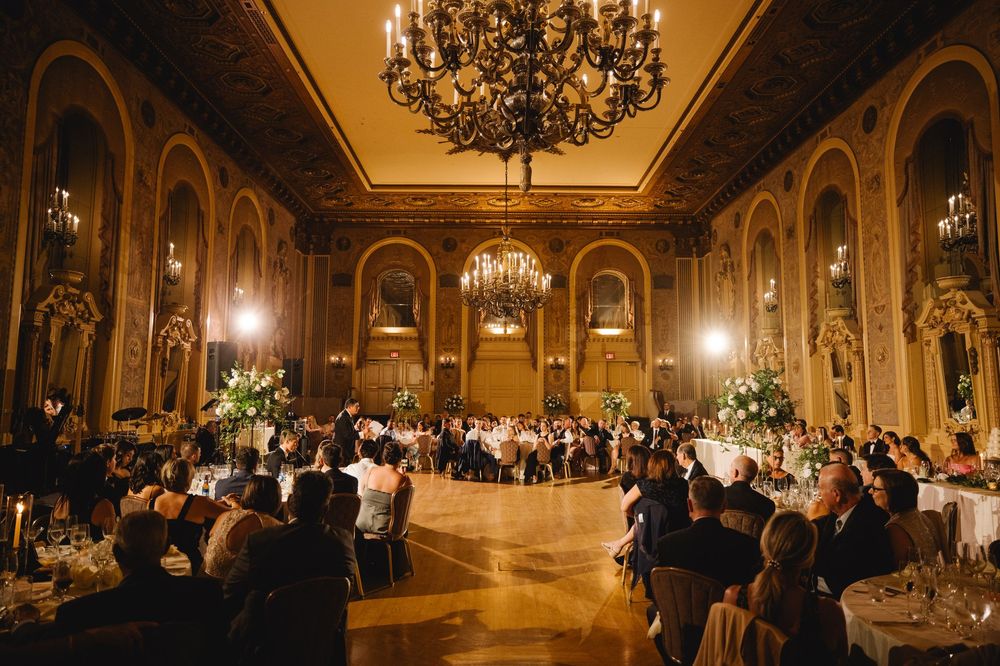 Luxurious wedding reception at The Hotel Dupont in Wilmington, Delaware with grand chandeliers and elegant ballroom ambiance.