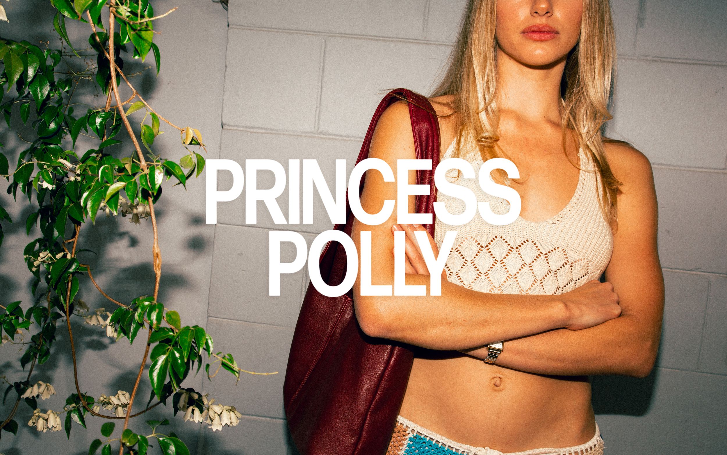 Person in white top poses against white wall with plants and Princess Polly text overlay.