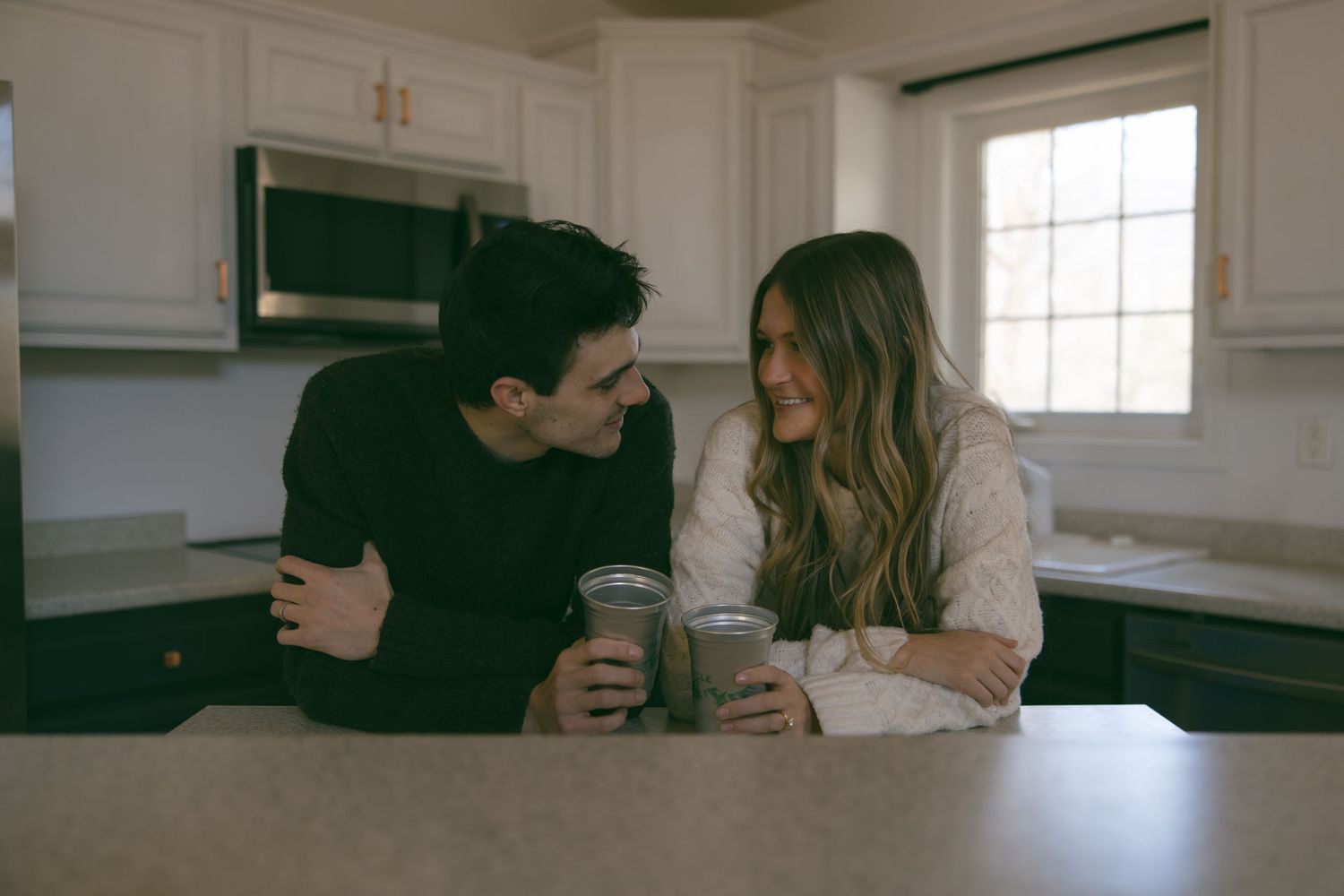 new home asheville photoshoot couples empty house lifestyle session kitchen celebrating