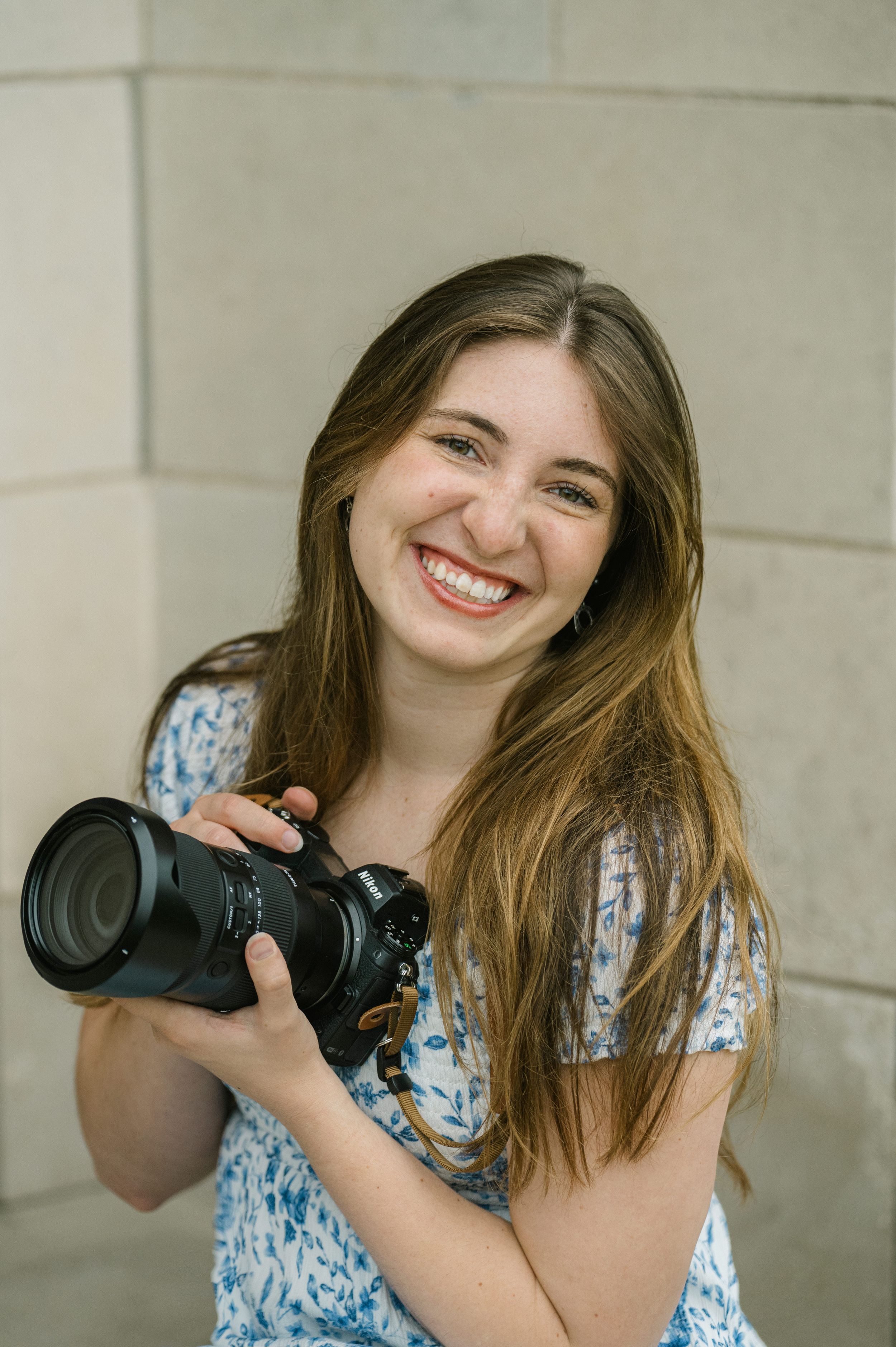 Taylor joy posing for photo with camera at venue 3 two
