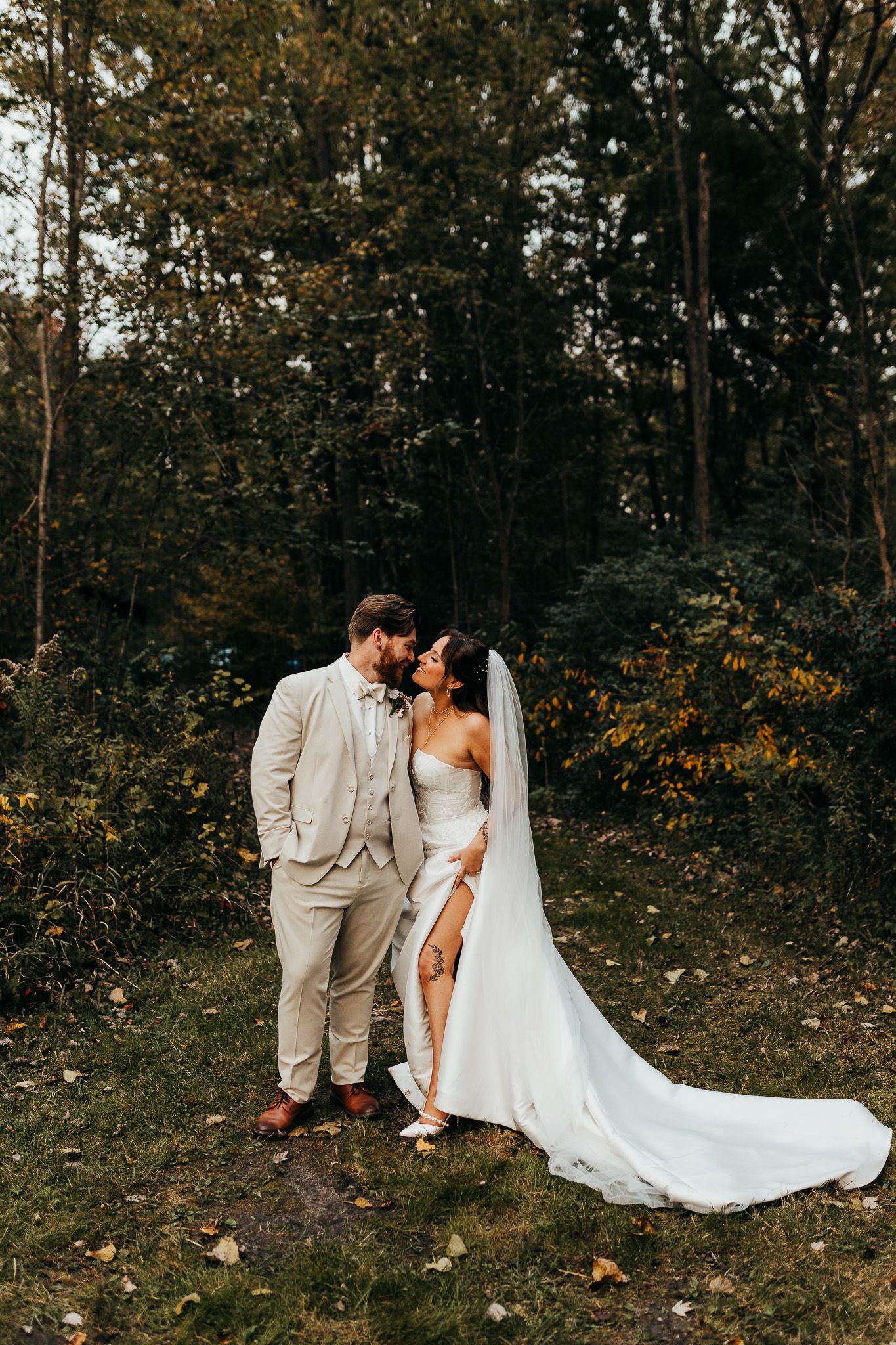 Close-up wedding photo capturing passionate kiss between newlyweds.