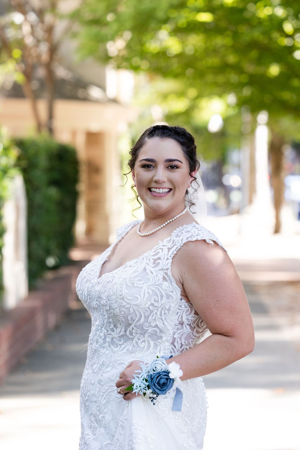 A series of outdoor bridal portraits featuring a white lace wedding dress against a sunlit garden background.