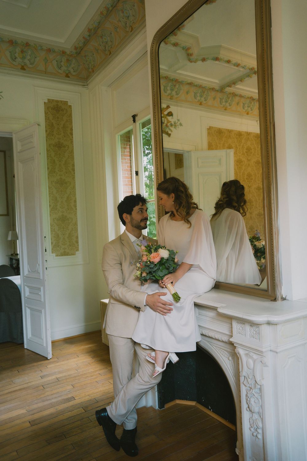 Artistic sequence showing dancing figures in a vintage-style room with ornate wallpaper and decorative mirrors.