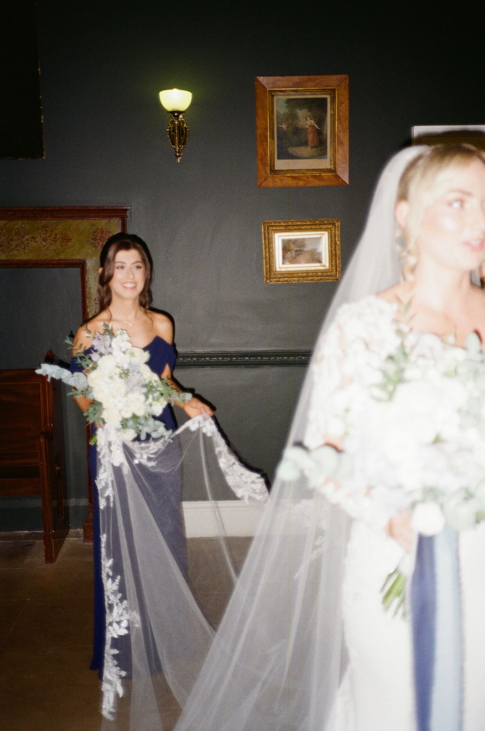 A sequence of motion-blurred wedding photos showing a bride in white veil and bridesmaid in navy dress walking together.