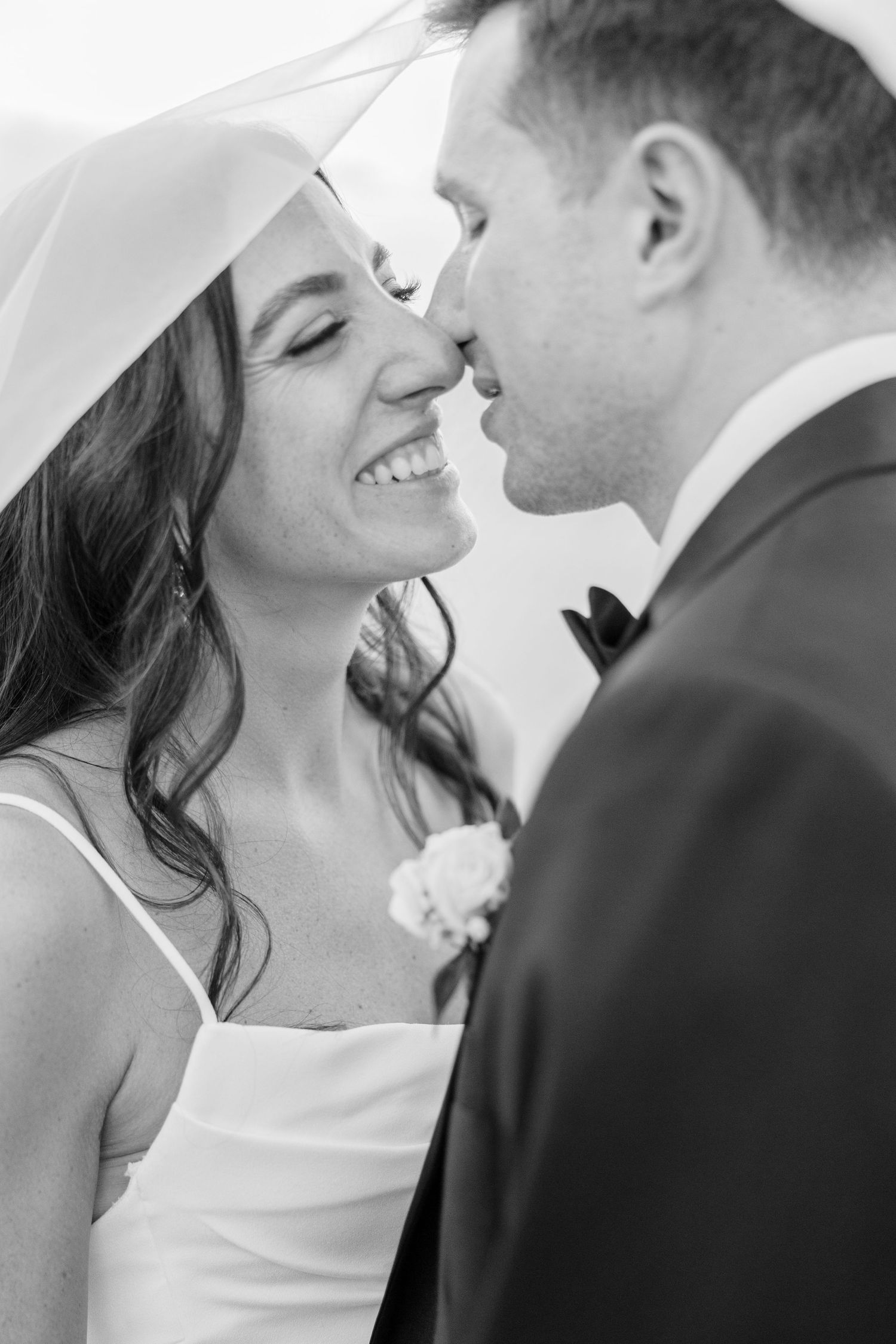 Romantic black and white wedding photography sequence showing tender moments between newlyweds.