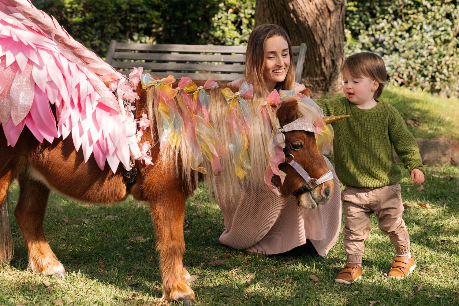 boy and his mom with a unicorn during a unicorn birthday photoshoot in Lane cove Sydney
