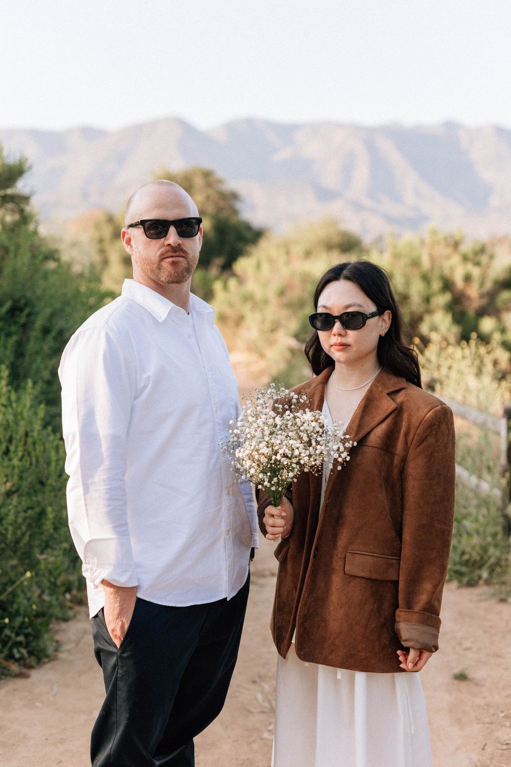Relaxed Ojai engagement photo shoot on film featuring stylish sunglasses and golden-hour light.