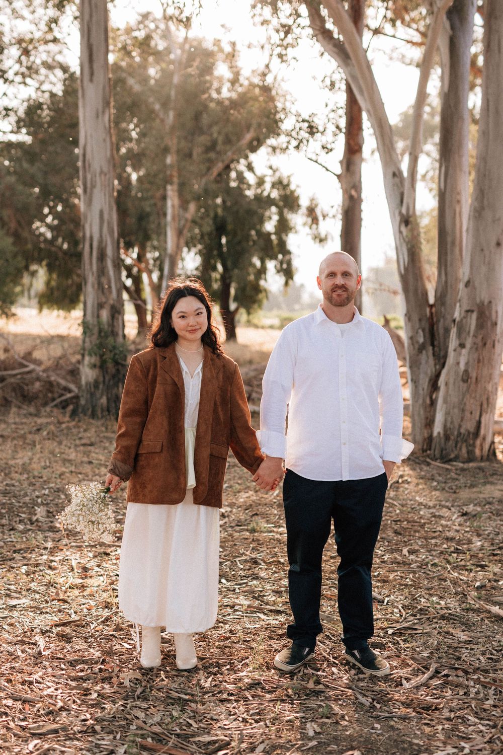 Soft, glowing 35mm film portrait capturing the quiet love between the couple in the golden Ojai light.