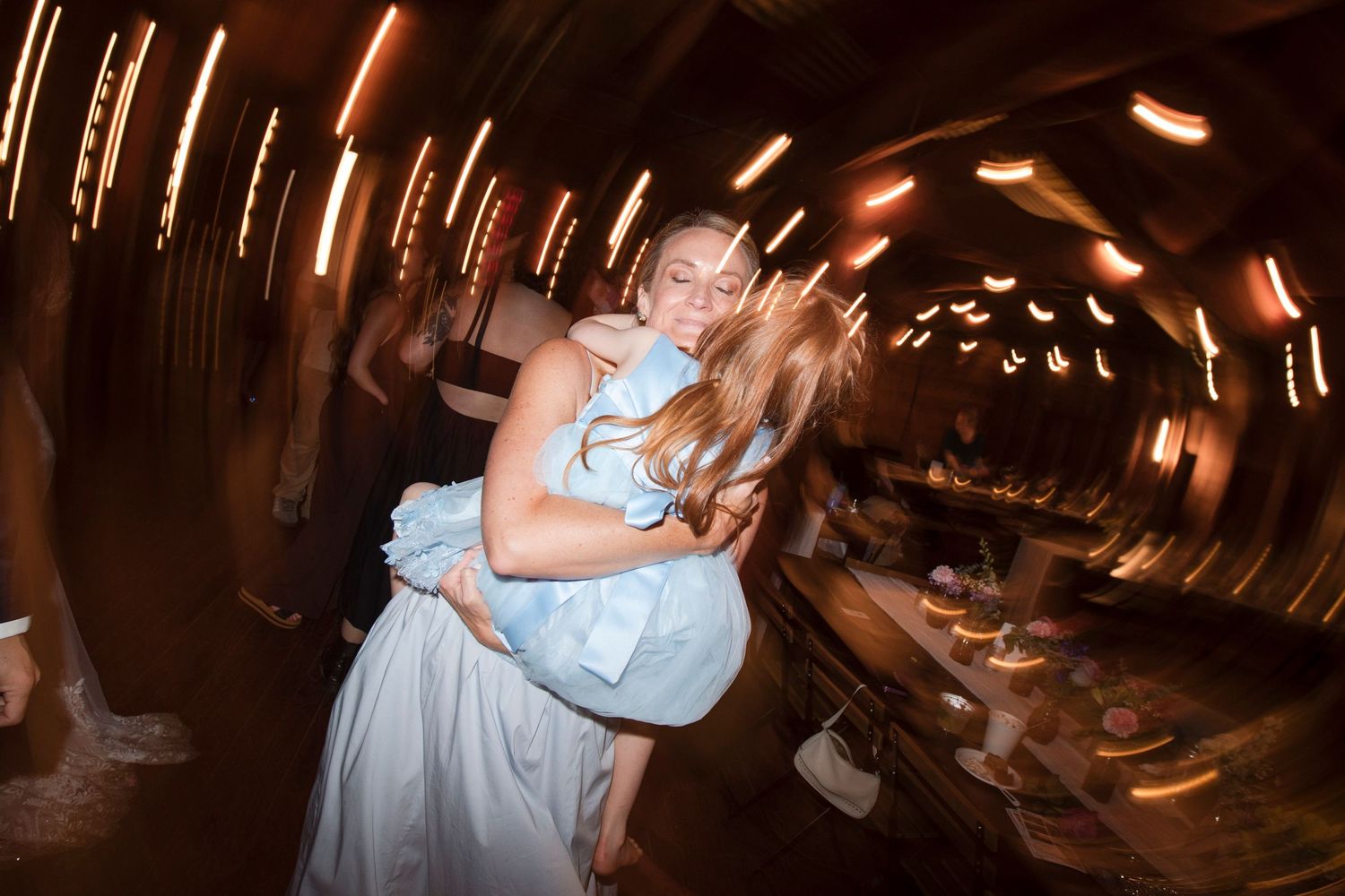 A romantic slow dance in a dimly lit tunnel creates a dreamy spinning effect with motion blur and warm lighting.