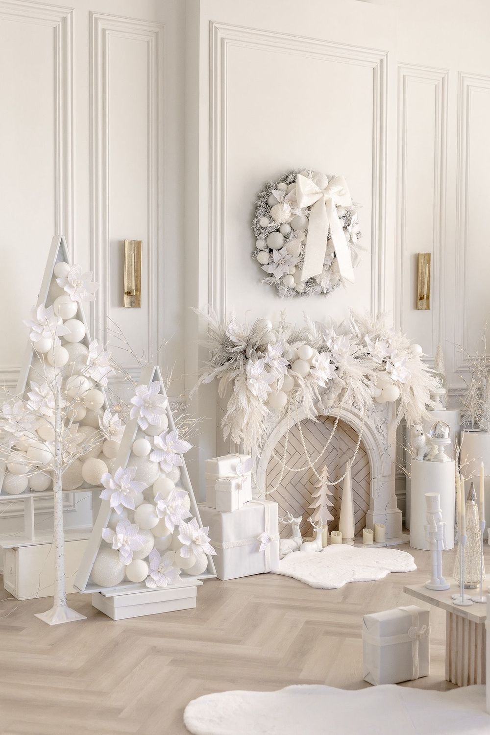 Modern white event setup with balloon installations, decorative arches, and luxury lounge furniture.
