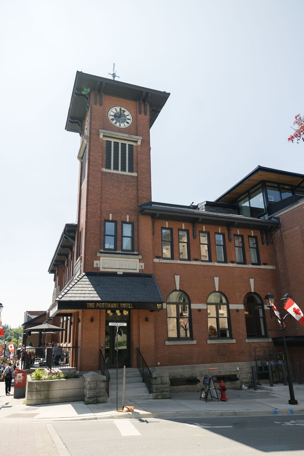 Exterior views of a classic brick train station building with clock tower shown from multiple angles.