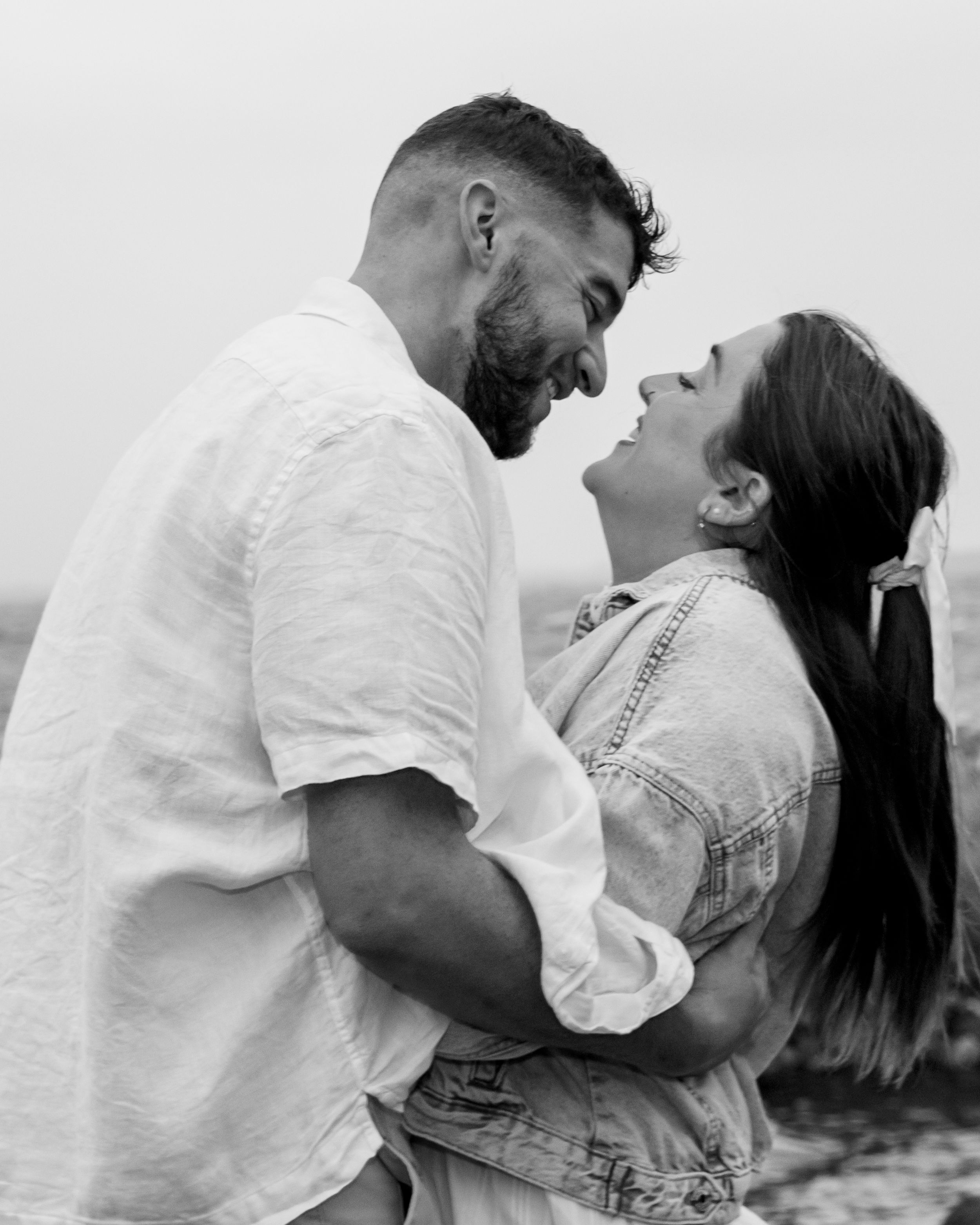 Black and white series showing intimate dance poses between a couple in casual attire.