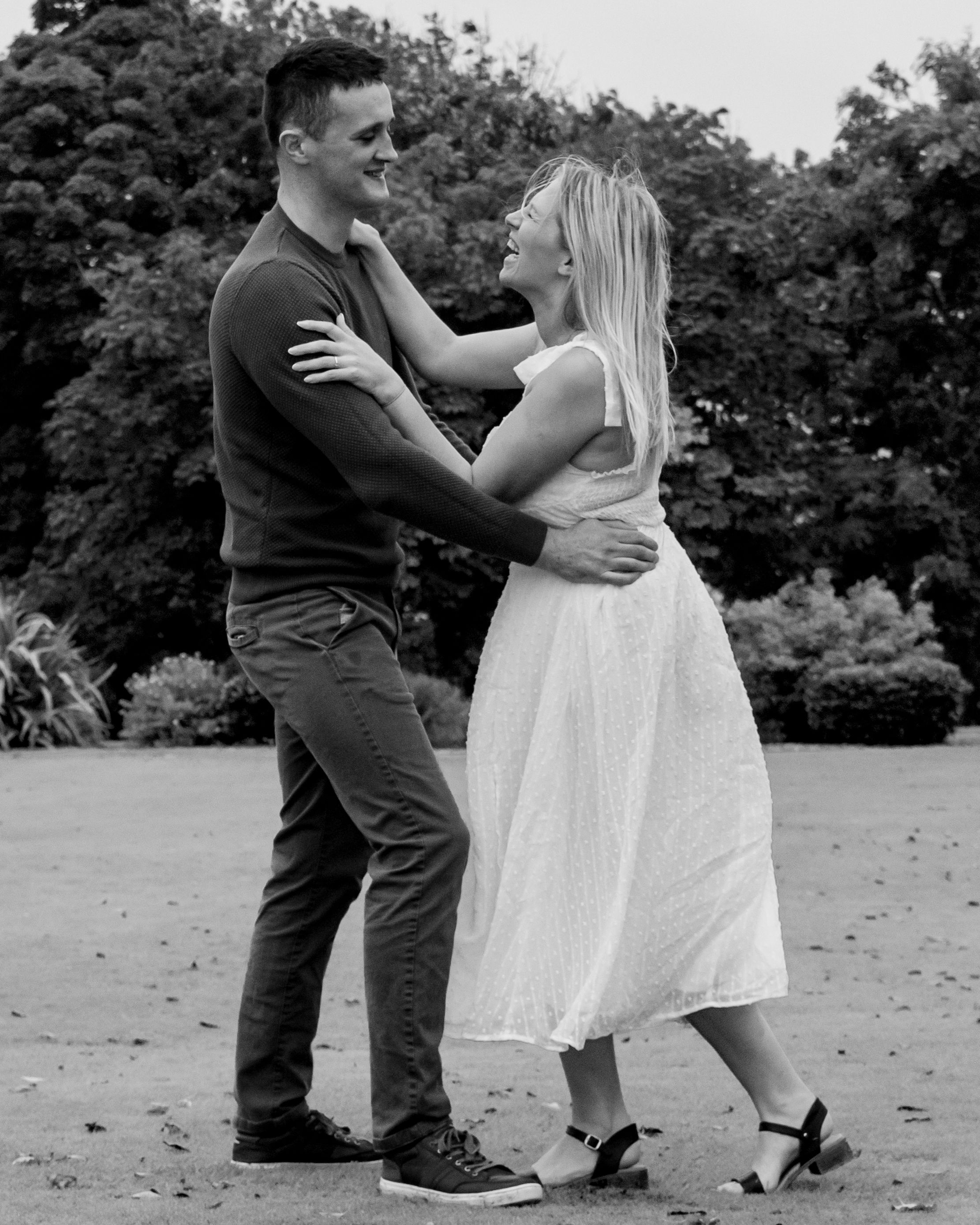 Black and white photo sequence showing tender moments between two people in an outdoor setting.