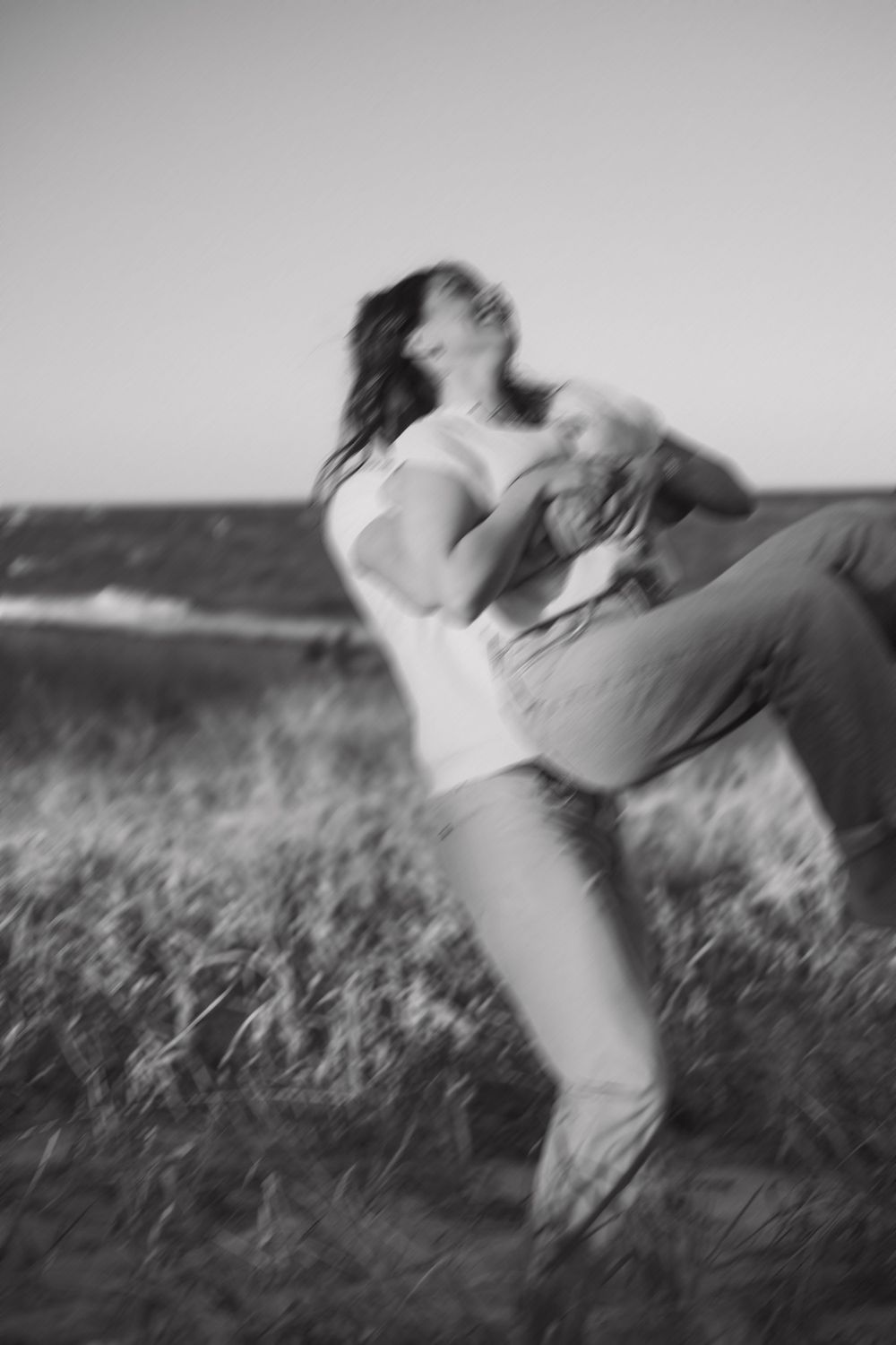 black and white image of couple spinning