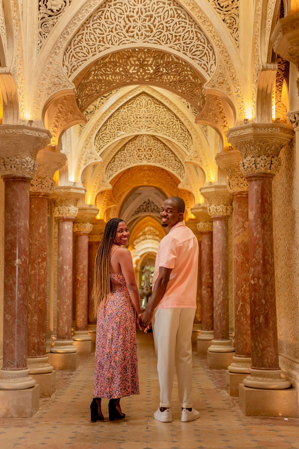 Tourists admire the ornate Moorish architecture and marble columns inside the Mezquita-Mosque Cathedral of Cordoba.