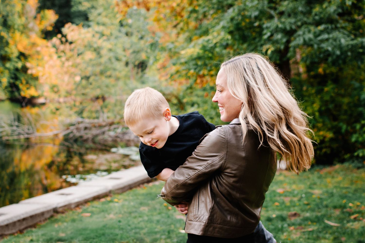 Mother and son during a fall family session at Lake Fenwick Park.
