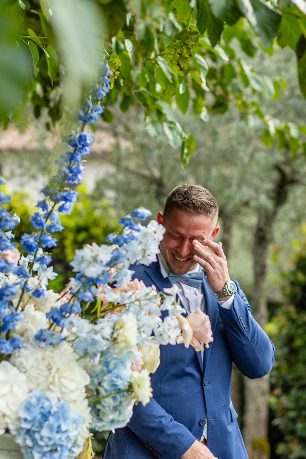 Emotional first look surrounded by olive trees in Umbria’s historic landscapes.