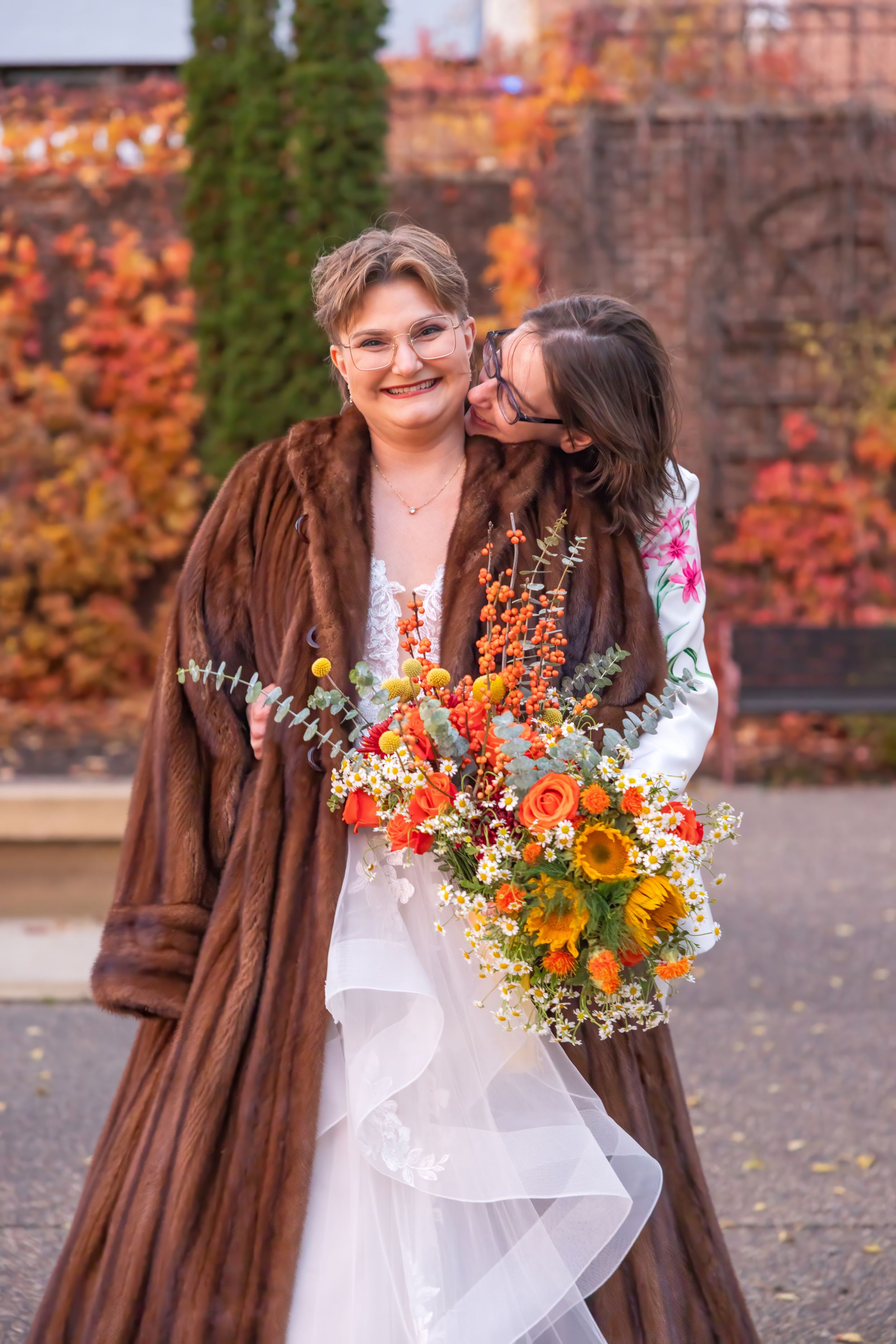 A series of fall portraits showing someone in a brown fur coat holding a vibrant orange and yellow bouquet.